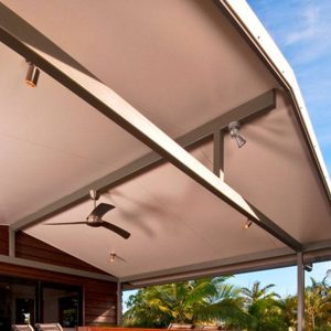 A close up photo showing an outdoor patio ceiling using Metrolls Solarspan® insulated roofing panels