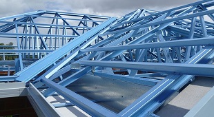 A photo of blue coloured BlueScope steel roof construction
